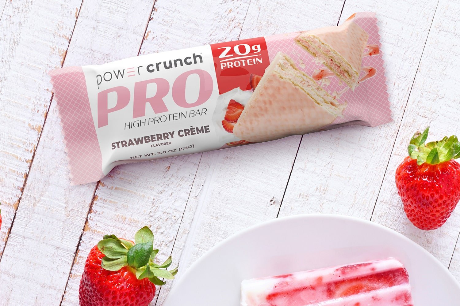 PRO Strawberry 20g protein bars pictured with Strawberry flavor explosion