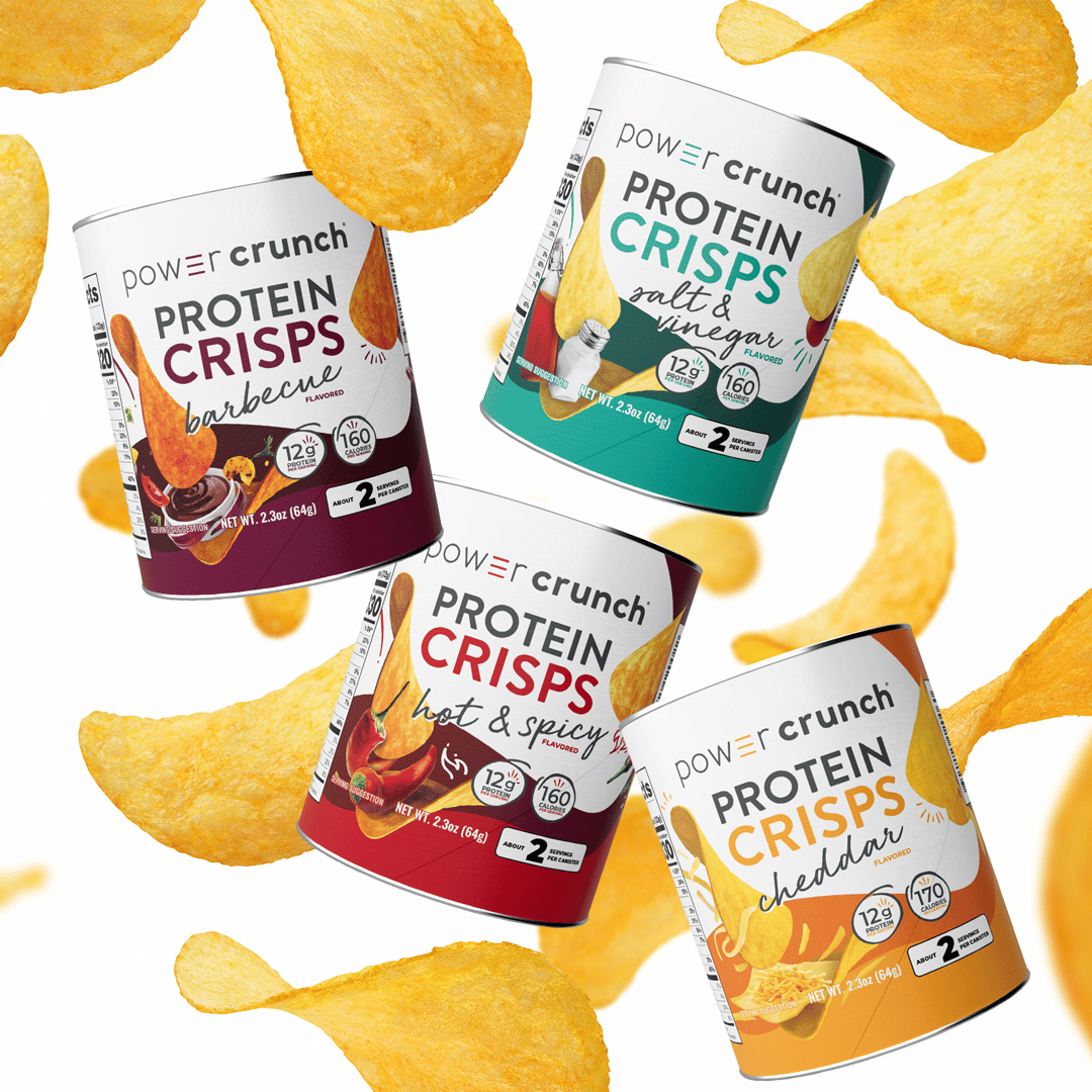Four cans of Power Crunch Protein Crisps with various flavors surrounded by crisps on a white background.