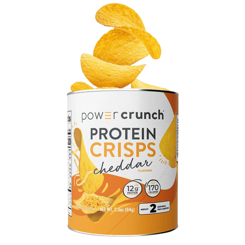 Can of Power Crunch Protein Crisps Cheddar flavor with crisps spilling out on a green background